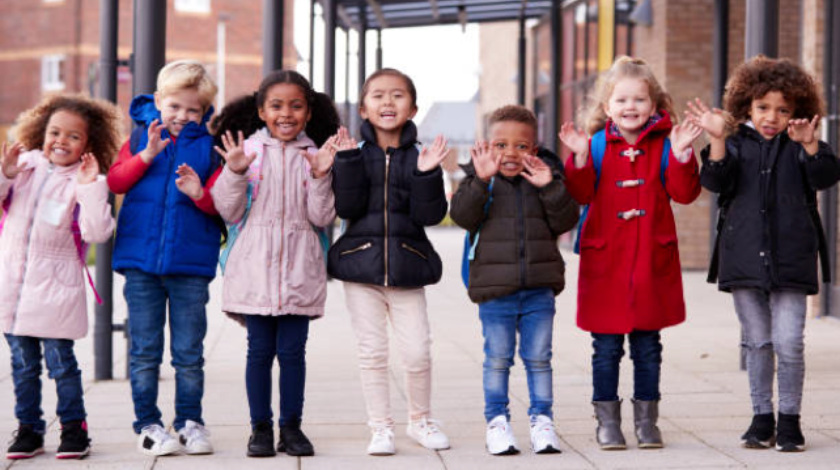 row of children with coats